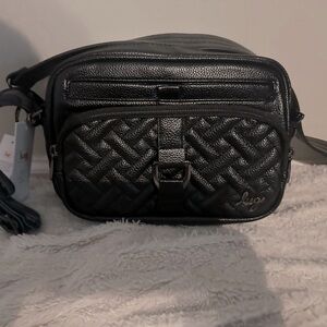 Lug vegan leather carousel black with camo interior.